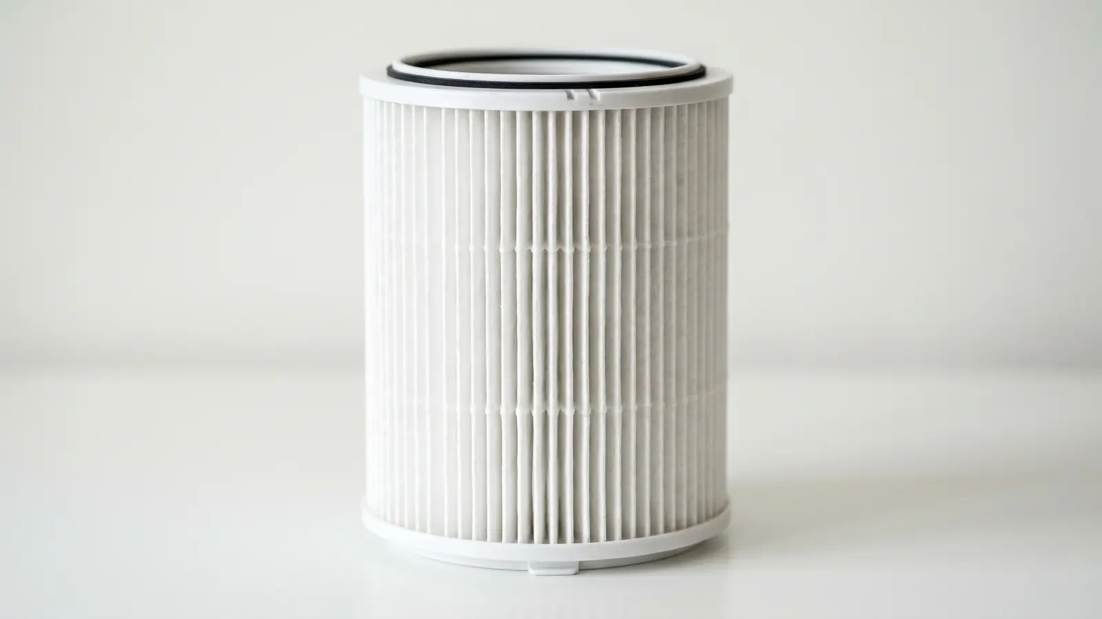 Cylindrical HEPA air purifier filter showing dense pleated filter media
